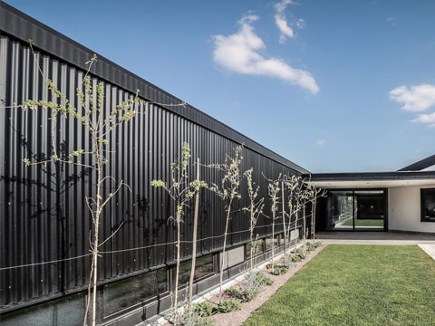 Black corrugated fence