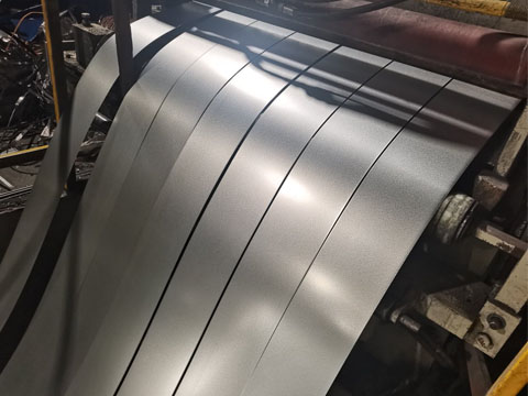 Alu-zinc steel coils being slit