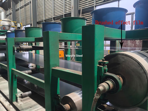 Brushed film applied to metal plate