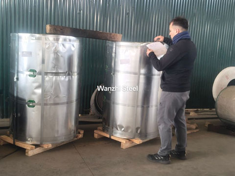 Customer agents inspect packaging